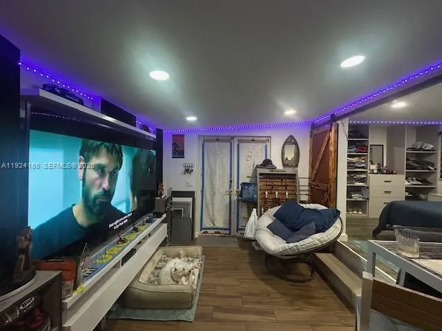 a room with furniture and a flat screen tv