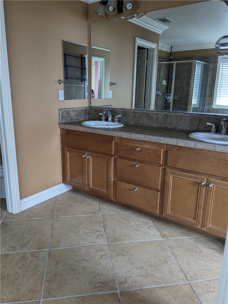 36071 Horseshoe Court Wildomar, CA 92595 - Photo 8 of 8 a spacious bathroom with a granite countertop sink and a mirror