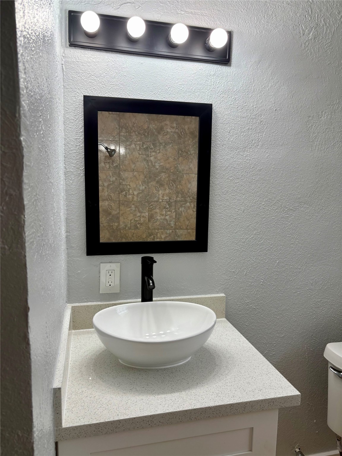 1125 Ann, Unit 11 Pasadena, TX 77506 - Photo 5 of 13 a bathroom with a sink and mirror