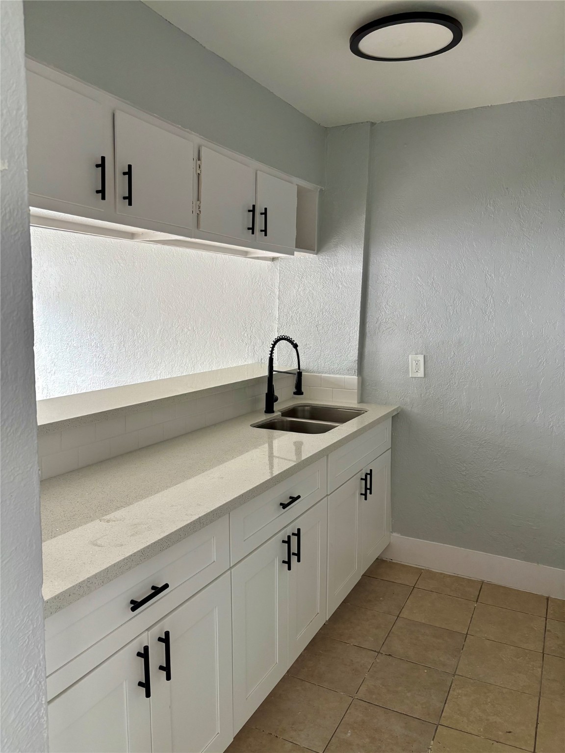 1125 Ann, Unit 11 Pasadena, TX 77506 - Photo 8 of 13 a bathroom with a sink and a mirror