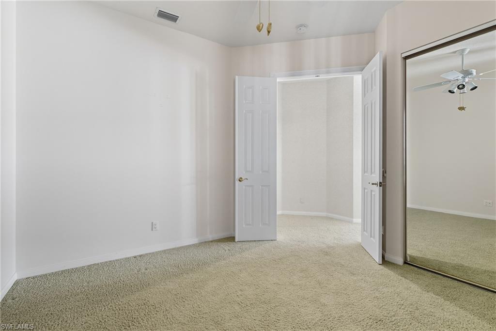 5925 Bermuda Lane Naples, FL 34119 - Photo 17 of 24 Unfurnished bedroom with carpet and a closet