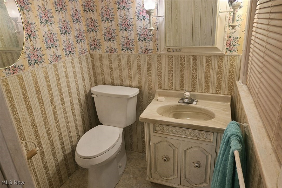 279 Coitsville Road Campbell, OH 44405 - Photo 9 of 20 Half bathroom with wallpapered walls and vanity