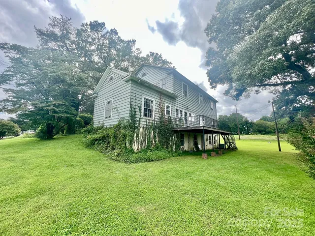 a view of a house with a yard porch and sitting area