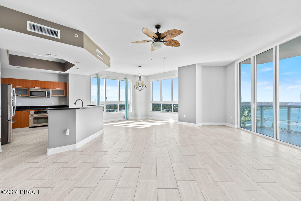 241 Riverside Drive, Unit 2610 Daytona Beach, FL 32117 - Photo 2 of 31 a view of an empty room with a window