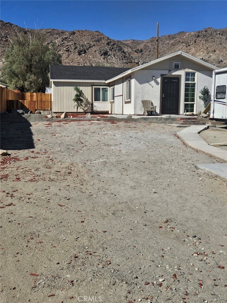82414 3rd Street Trona, CA 93562 - Photo 2 of 13 a front view of a house with a yard