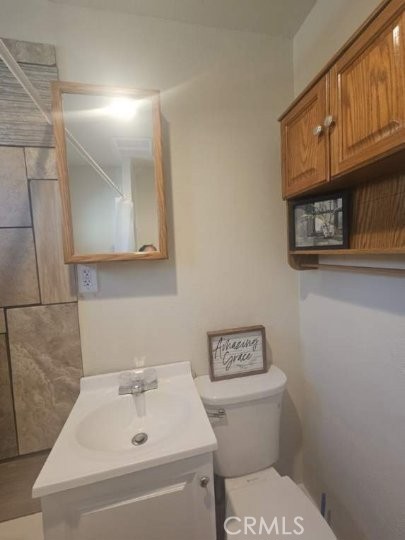 82414 3rd Street Trona, CA 93562 - Photo 6 of 13 a bathroom with a sink a toilet and vanity