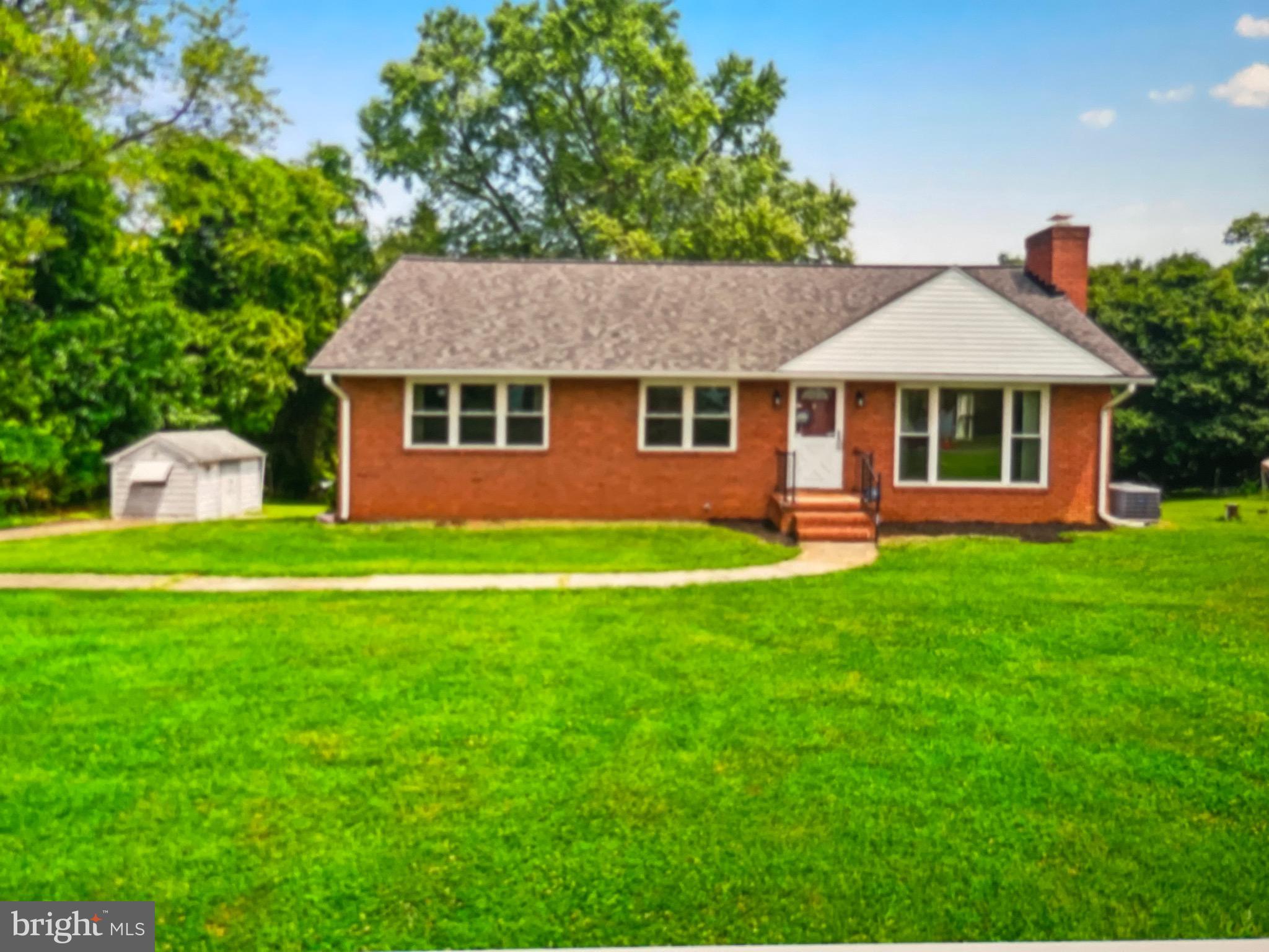 8608 Inwood Road Windsor Mill, MD 21244 - Photo 2 of 20 a front view of house with yard and green space