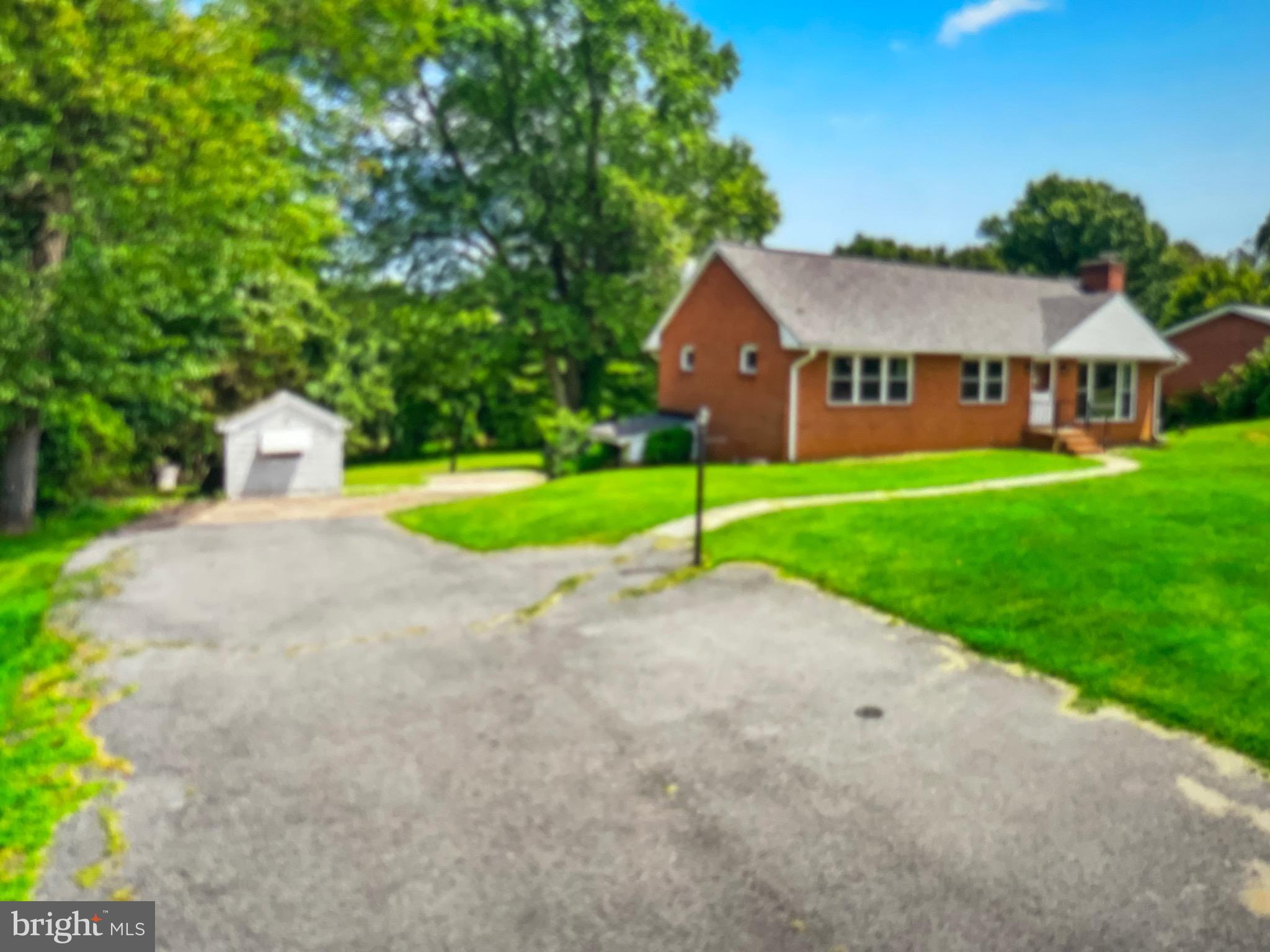 8608 Inwood Road Windsor Mill, MD 21244 - Photo 3 of 20 a view of a house with a yard and pathway