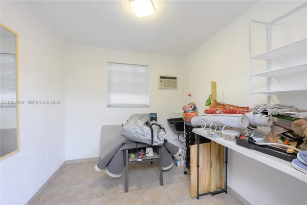 a view of a table and chairs under an umbrella in the patio