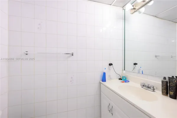 a living room with furniture and flowers