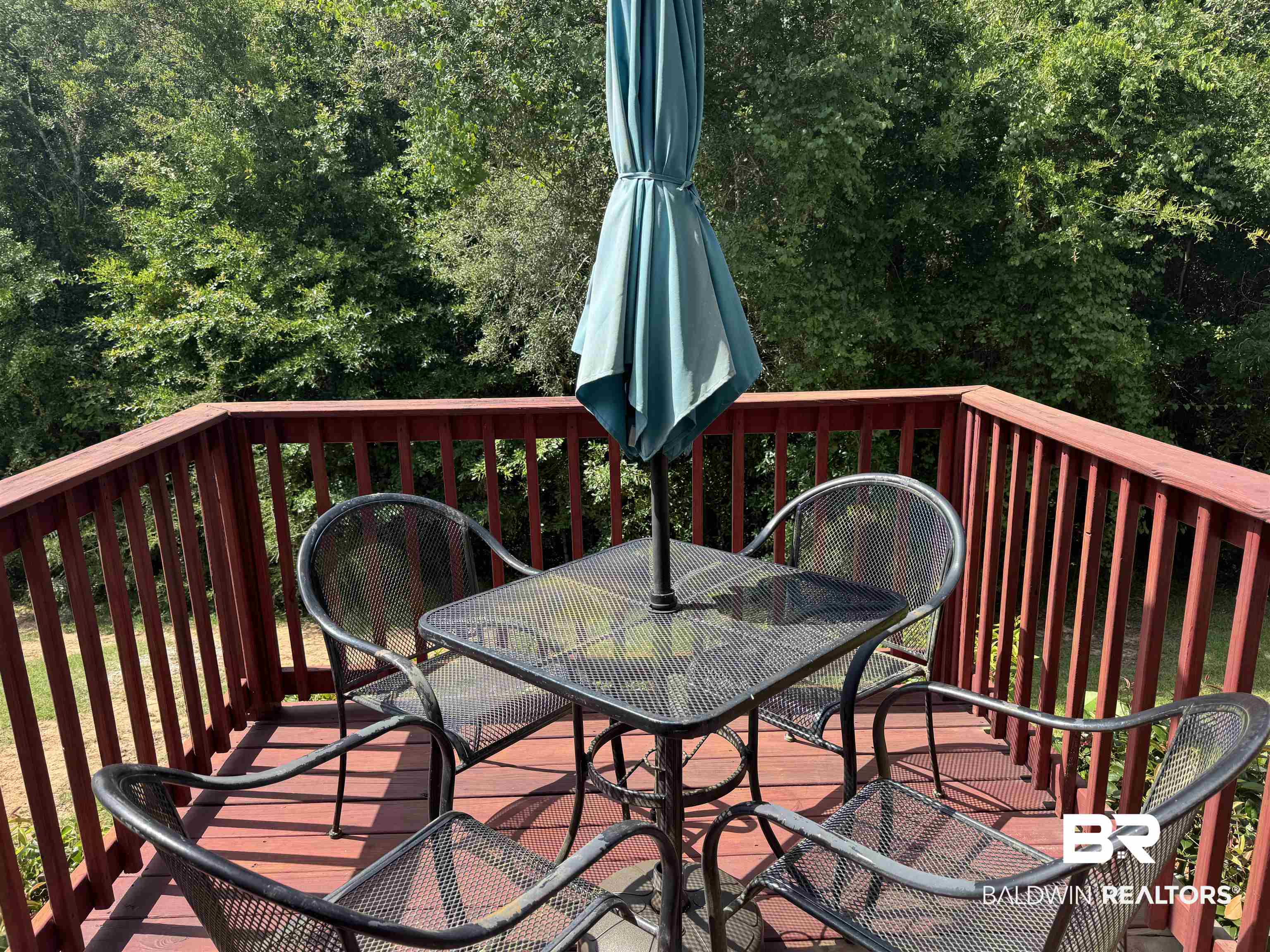 6811 Spaniel Drive, Unit C Daphne, AL 36527 - Photo 8 of 33 Wooden terrace with outdoor dining area