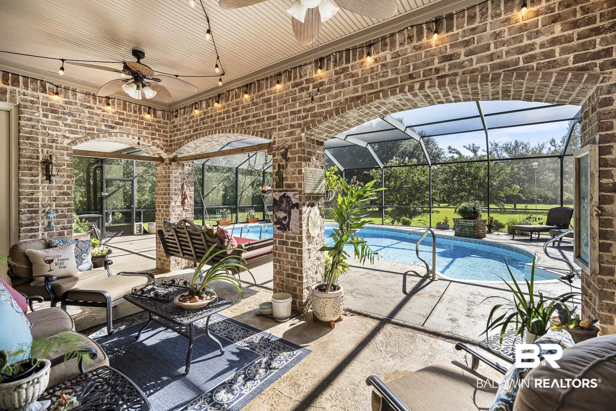 25212 Austin Road Daphne, AL 36526 - Photo 45 of 56 Outdoor pool featuring a patio area, a lanai, an outdoor living space, and a ceiling fan