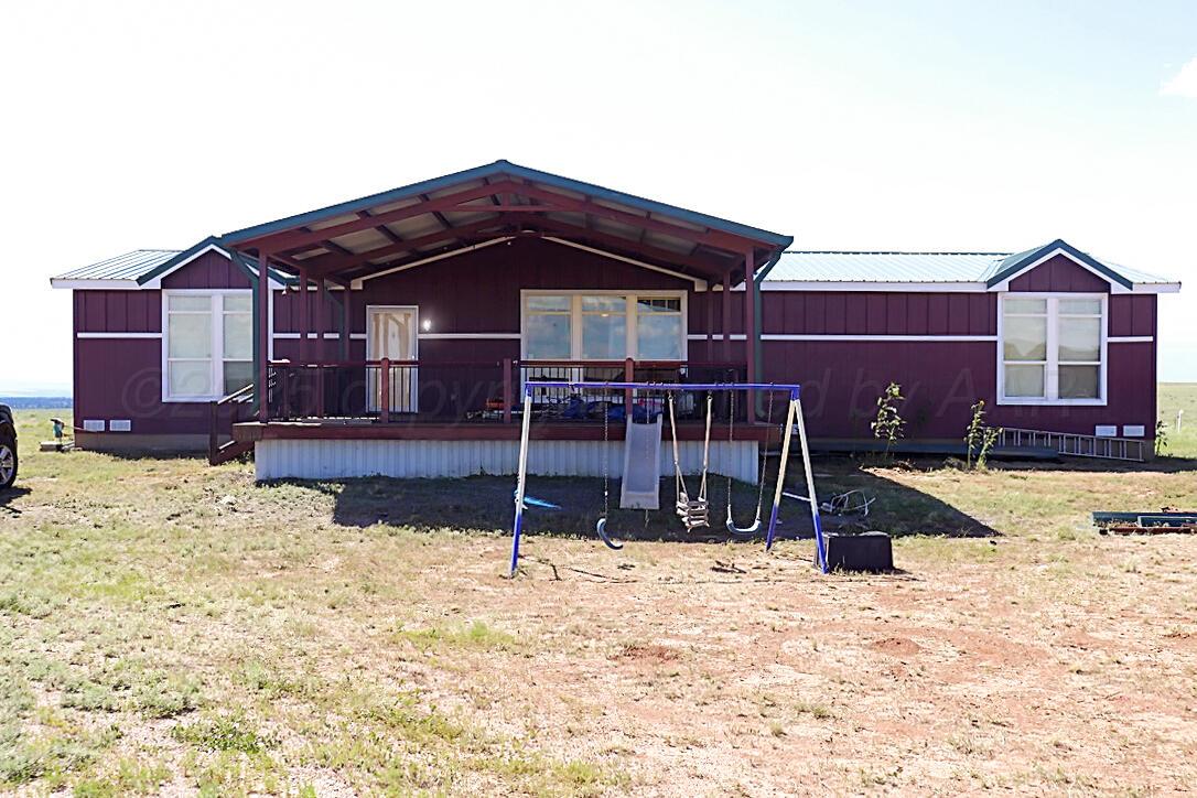 735 Wagon Mound Highway Other - Not In List, NM 87743 - Photo 11 of 39 a view of a house with a yard covered in snow