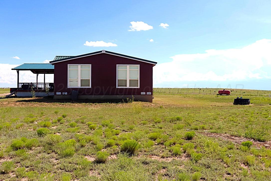 735 Wagon Mound Highway Other - Not In List, NM 87743 - Photo 12 of 39 a front view of a house with a yard