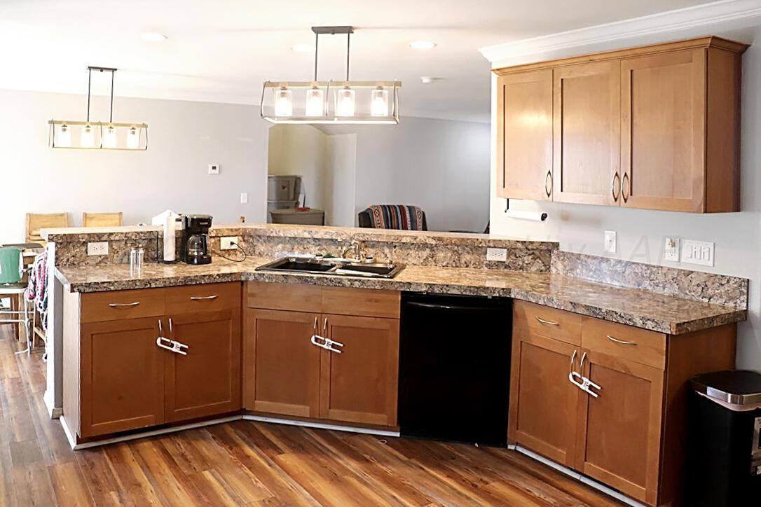 735 Wagon Mound Highway Other - Not In List, NM 87743 - Photo 19 of 39 a kitchen with granite countertop cabinets stainless steel appliances a sink and a counter top space