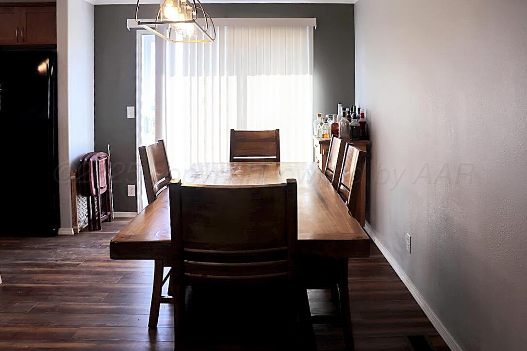 735 Wagon Mound Highway Other - Not In List, NM 87743 - Photo 24 of 39 a view of a workspace with furniture and wooden floor
