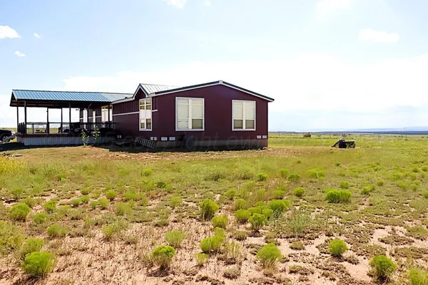 a view of a backyard of a house