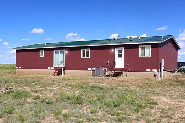 a front view of house with yard and seating area