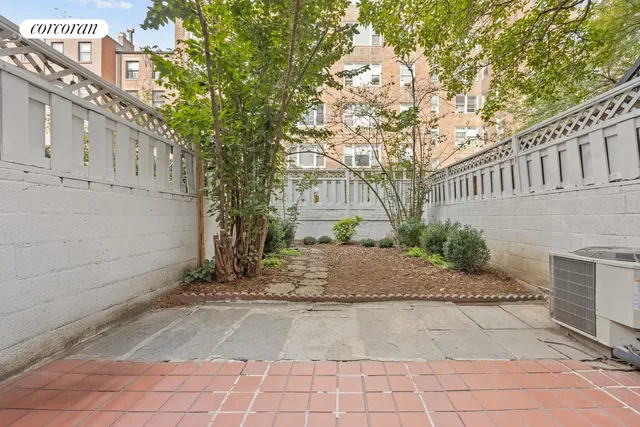 a bath tub sitting in a bathroom next to a window