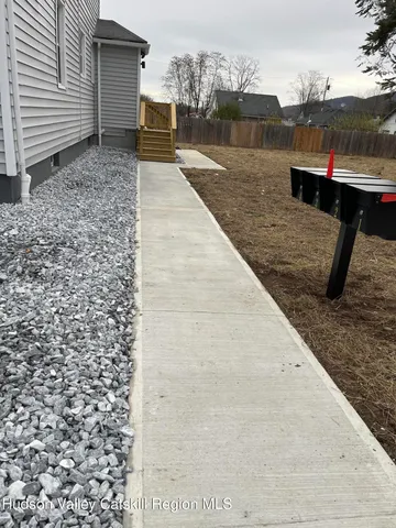 a view of a terrace with wooden fence
