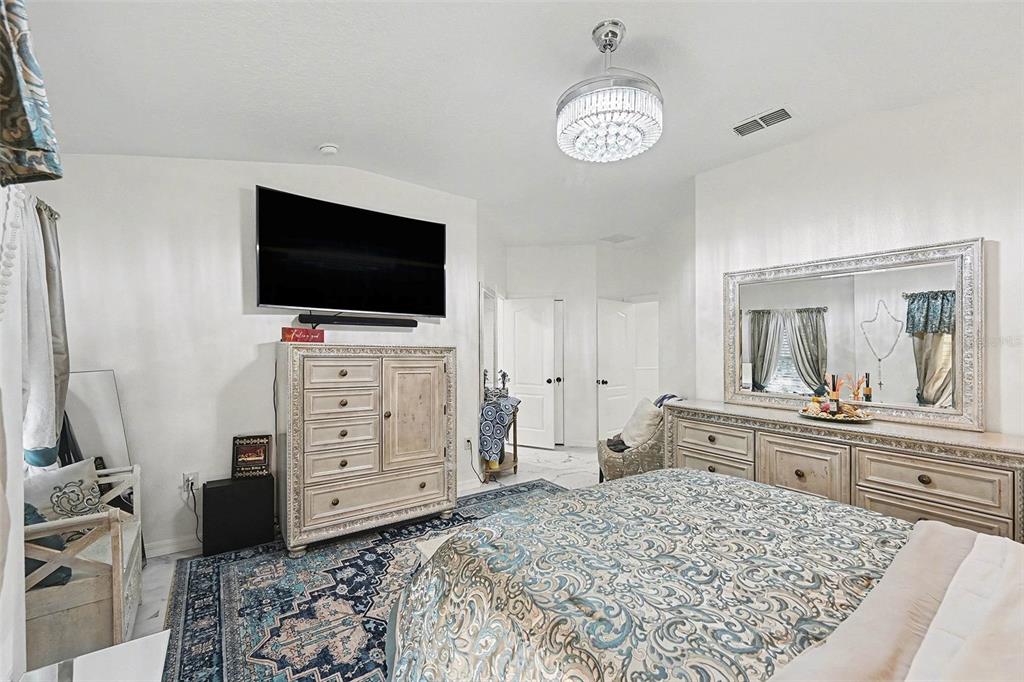 3565 Clay Brick Road, Unit 47 Harmony, FL 34773 - Photo 21 of 37 a living room with furniture and a flat screen tv