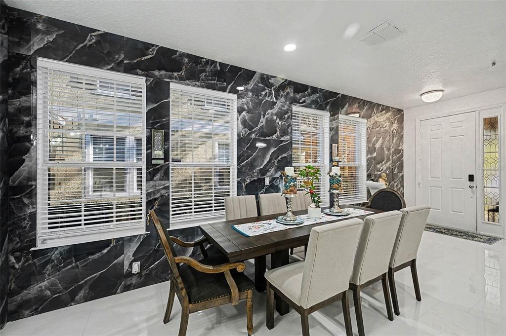 3565 Clay Brick Road, Unit 47 Harmony, FL 34773 - Photo 10 of 37 a view of a dining room with furniture and wooden floor