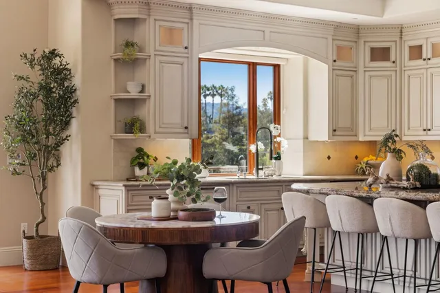a view of a dining room with furniture and window