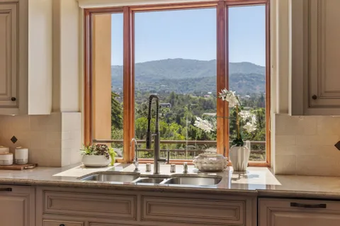 a view of a sink and a granite counter top