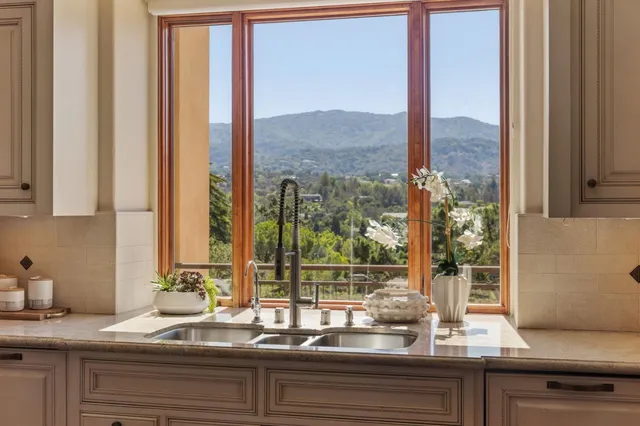 a view of a sink and a granite counter top