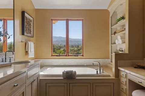 a bathroom with a sink and a window