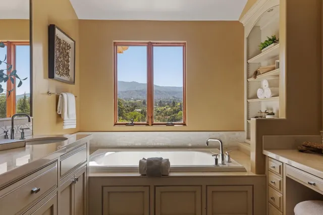 a bathroom with a sink and a window