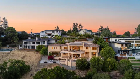 an aerial view of residential houses with yard