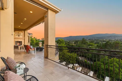a balcony with chairs