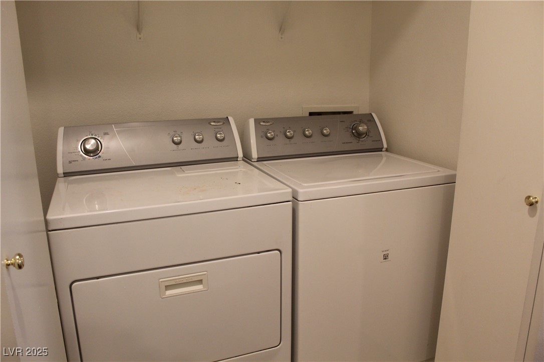 Undisclosed Address Las Vegas, NV 89129 - Photo 13 of 26 Washroom featuring washing machine and clothes dry
