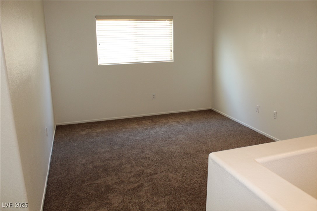 Undisclosed Address Las Vegas, NV 89129 - Photo 14 of 26 Empty room featuring carpet floors and baseboards
