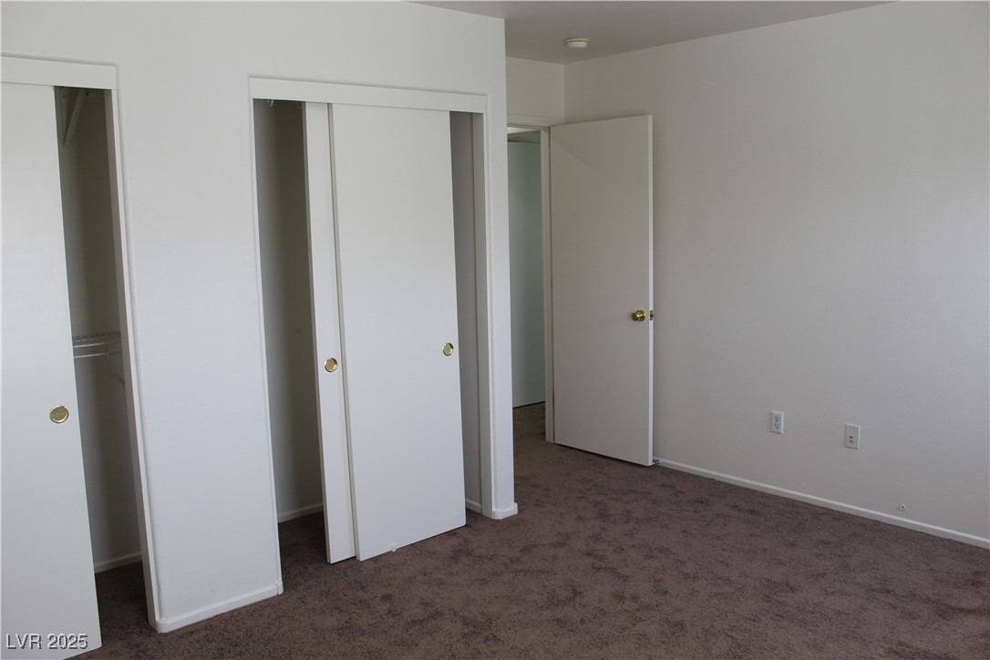 Undisclosed Address Las Vegas, NV 89129 - Photo 20 of 26 Unfurnished bedroom featuring carpet flooring and