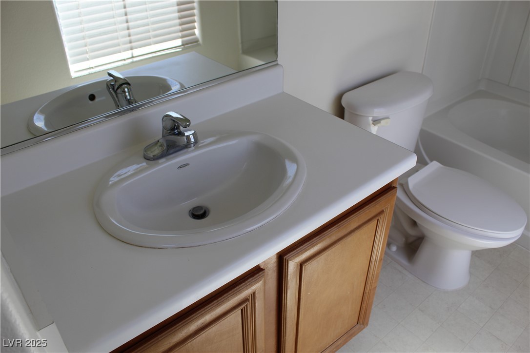 Undisclosed Address Las Vegas, NV 89129 - Photo 23 of 26 Full bath featuring a tub to relax in, vanity, a s