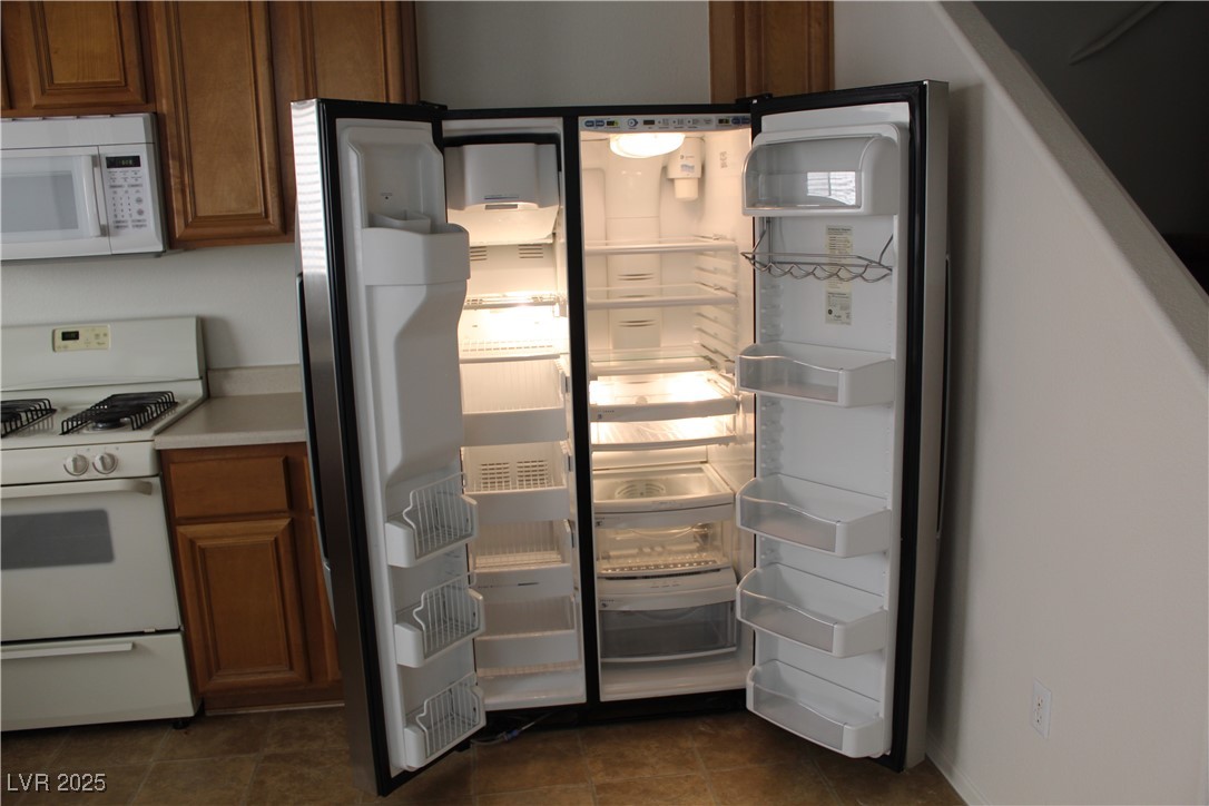 Undisclosed Address Las Vegas, NV 89129 - Photo 8 of 26 Interior details with light countertops, brown cab