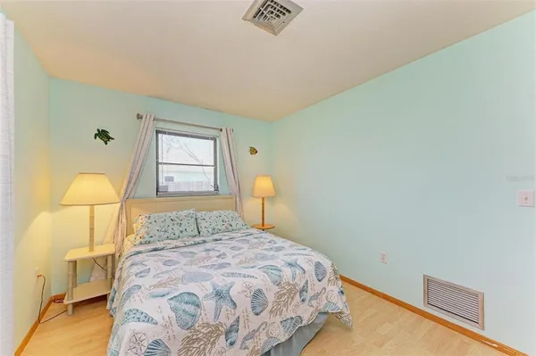 a view of a building and a yard in front of it