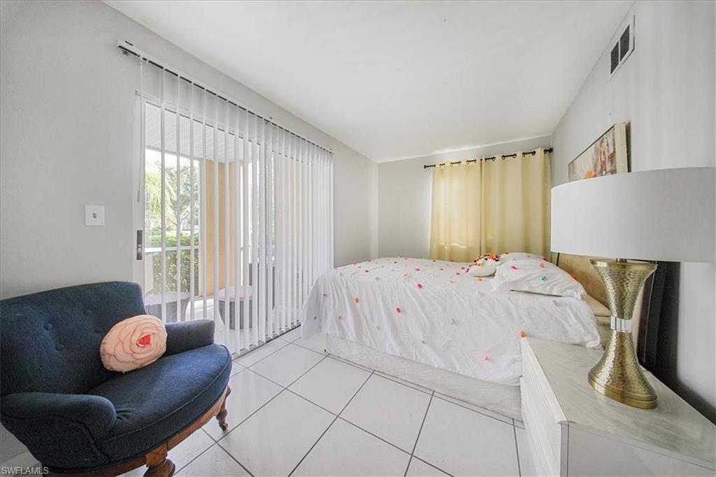 3170 Seasons Way, Unit 802 Estero, FL 33928 - Photo 18 of 31 a bedroom with furniture and a bed