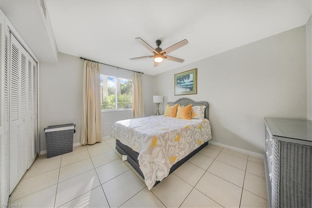 3170 Seasons Way, Unit 802 Estero, FL 33928 - Photo 19 of 31 a bedroom with a bed and window