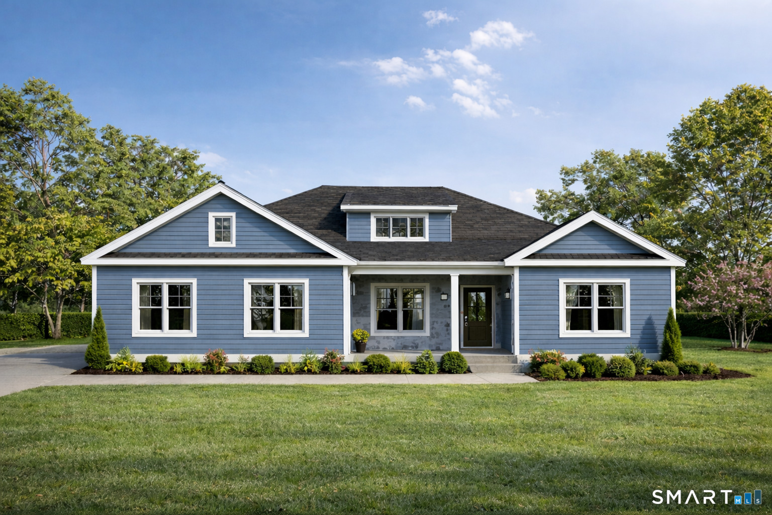 a front view of a house with a yard