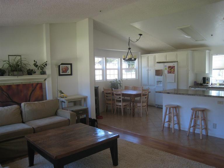 334 North Rice Road Ojai, CA 93023 - Photo 5 of 18 a living room with furniture a dining table and a window
