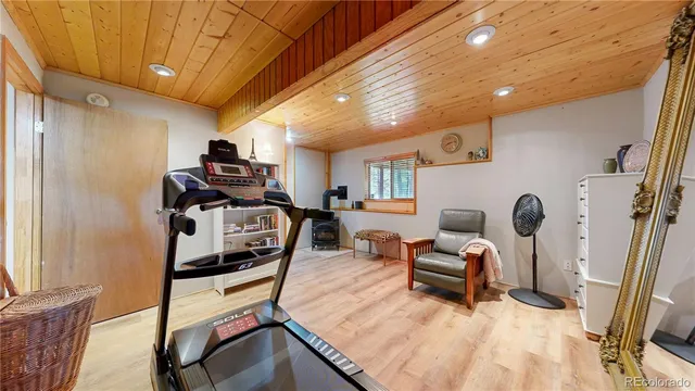 a bedroom with furniture and a window