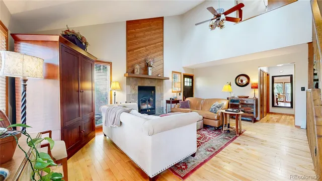a living room with furniture fireplace and flat screen tv