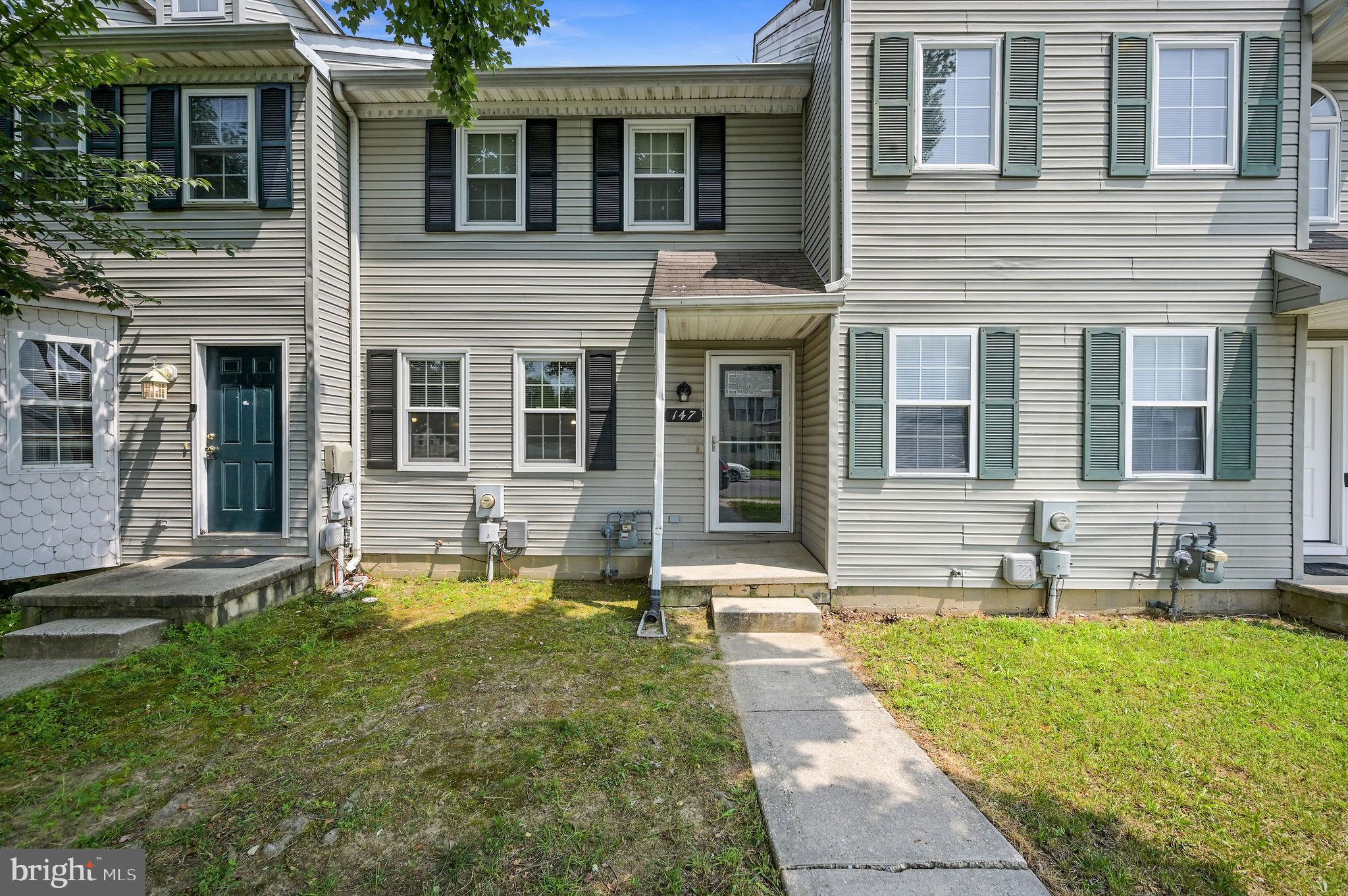 147 Holmes Street Dover, DE 19901 - Photo 1 of 19 a swimming pool with outdoor seating and yard