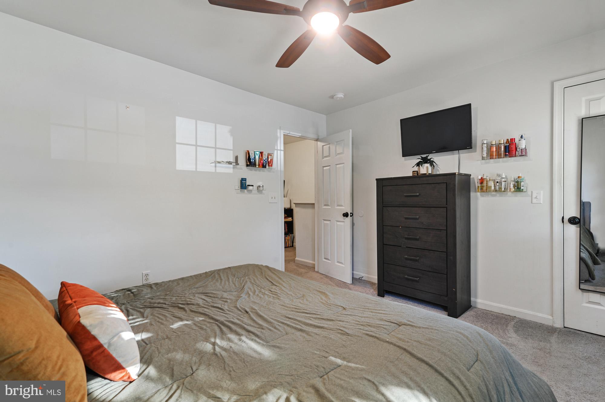 147 Holmes Street Dover, DE 19901 - Photo 12 of 19 a bedroom with a bed and flat screen tv