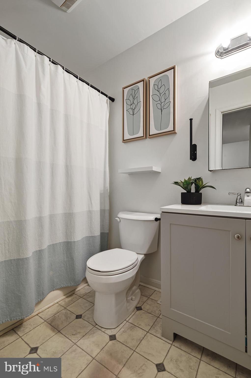 147 Holmes Street Dover, DE 19901 - Photo 14 of 19 a bathroom with a sink toilet and shower