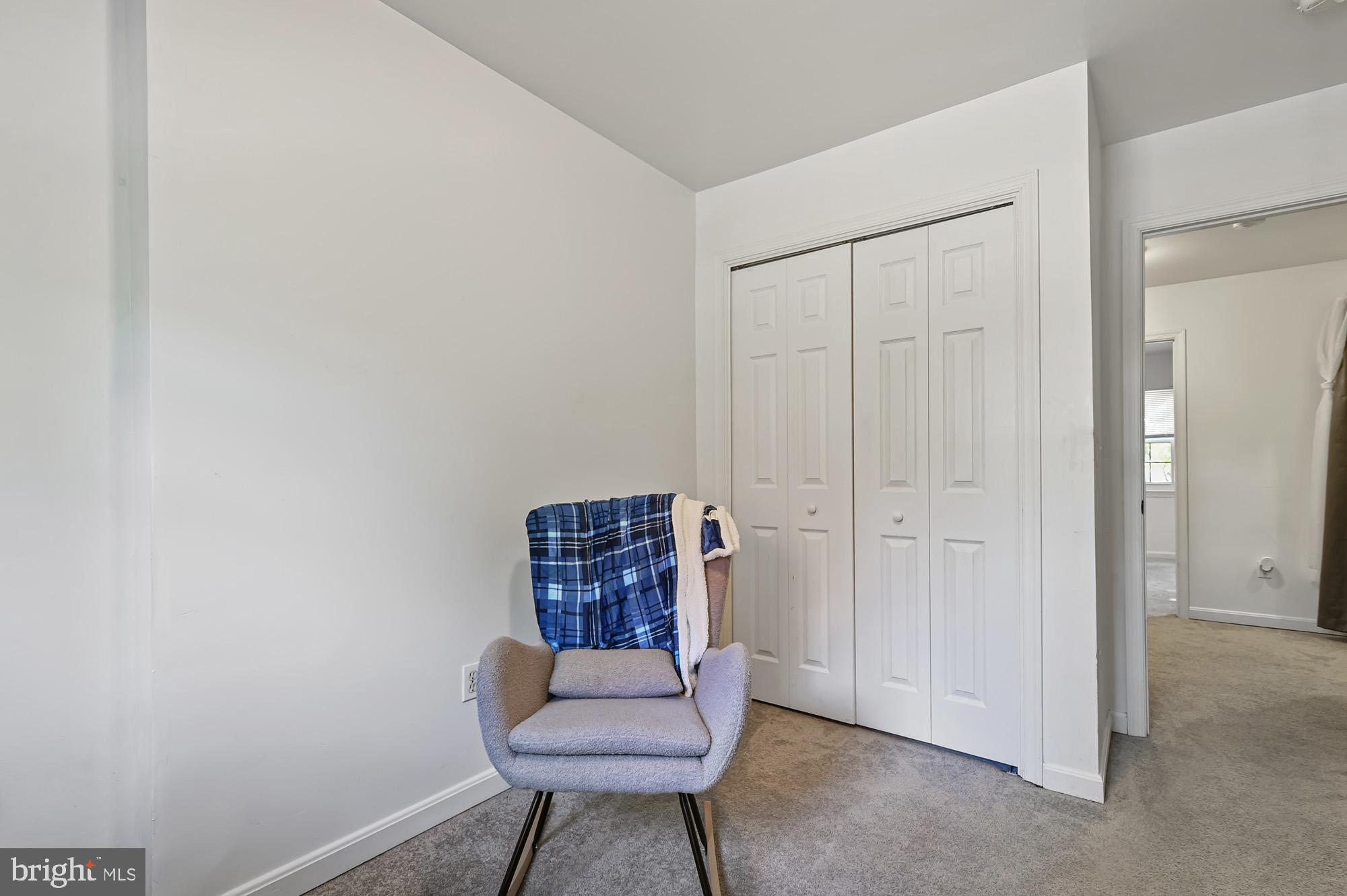 147 Holmes Street Dover, DE 19901 - Photo 16 of 19 a room with a chair and storage