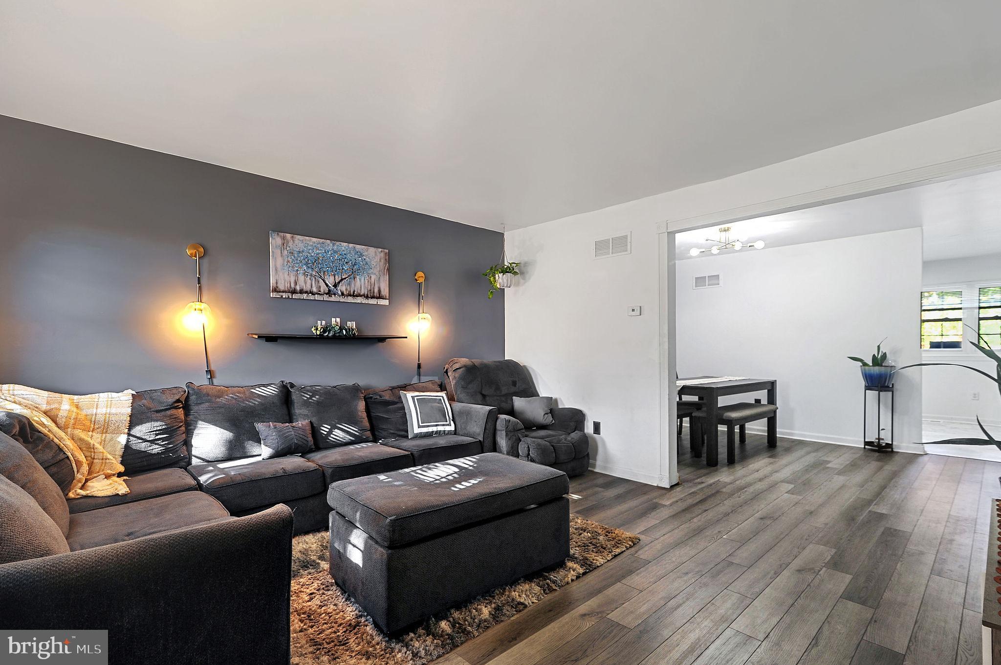 147 Holmes Street Dover, DE 19901 - Photo 2 of 19 a living room with furniture and a wooden floor